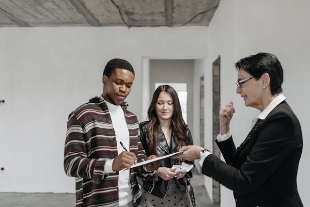Signing the Document the Agent is Handing