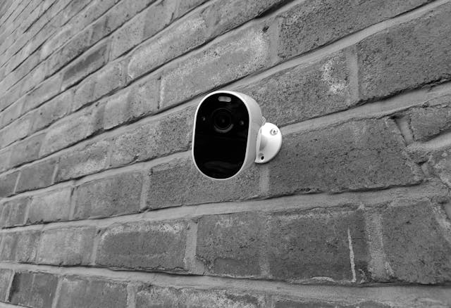 a home security camera on an exterior wall