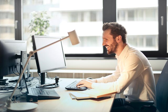 property manager sitting at their desk looking at a computer