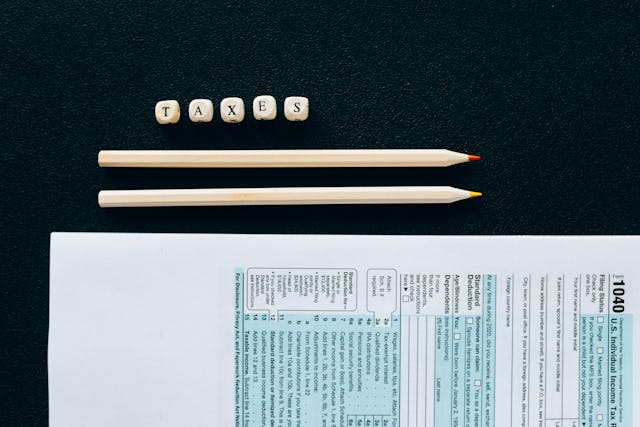 a tax for with two pencils next to it